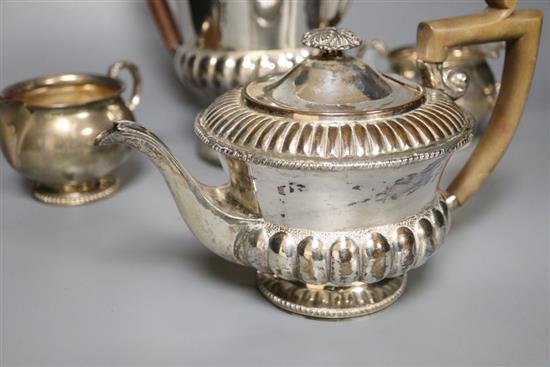 A silver milk jug and sugar bowl and a plated teapot and matching hot water jug,